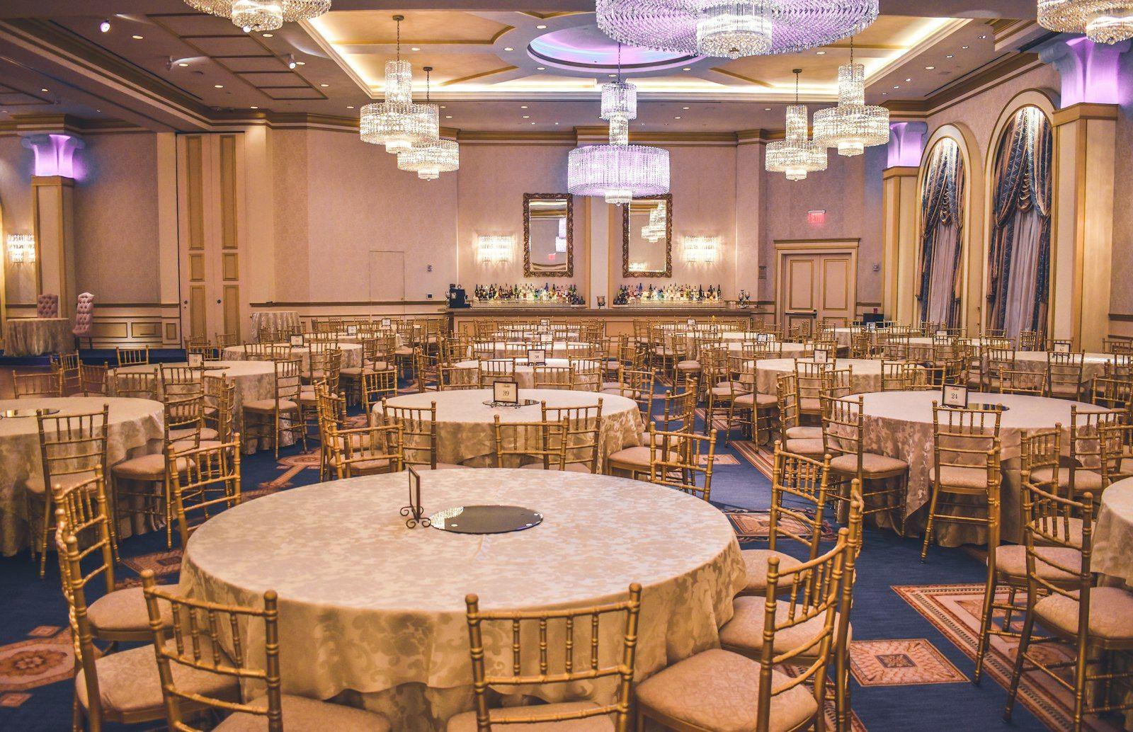 Grand ballroom dressed in white florals and candlelight