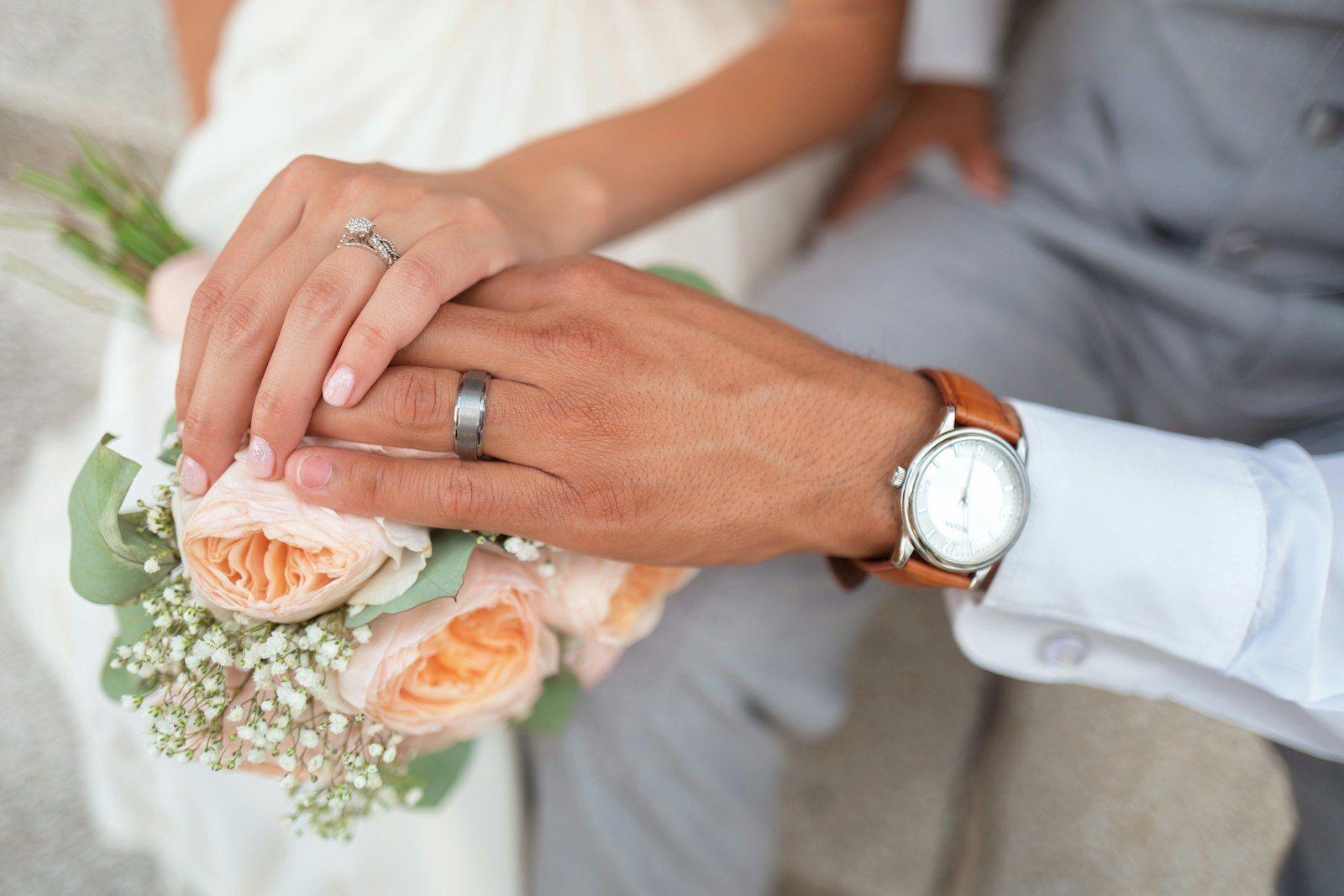 Bride holding a bouquet in soft window light